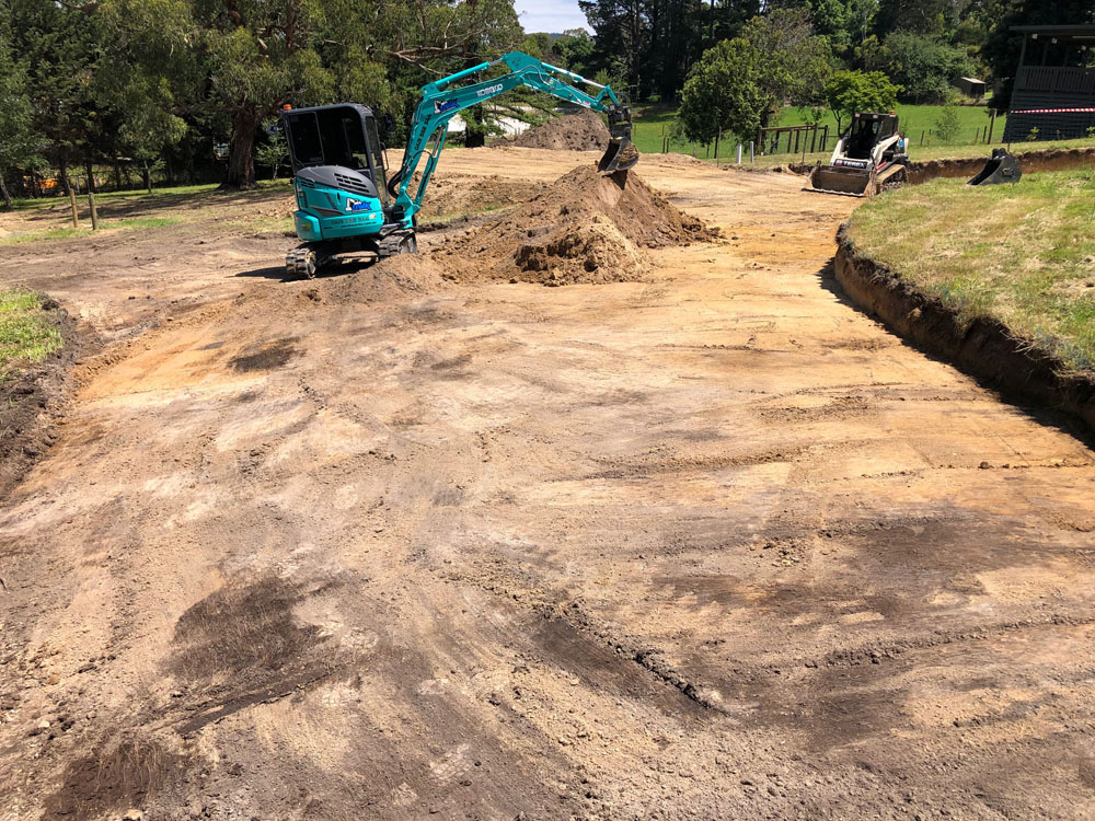 Mini excavator grading residential site